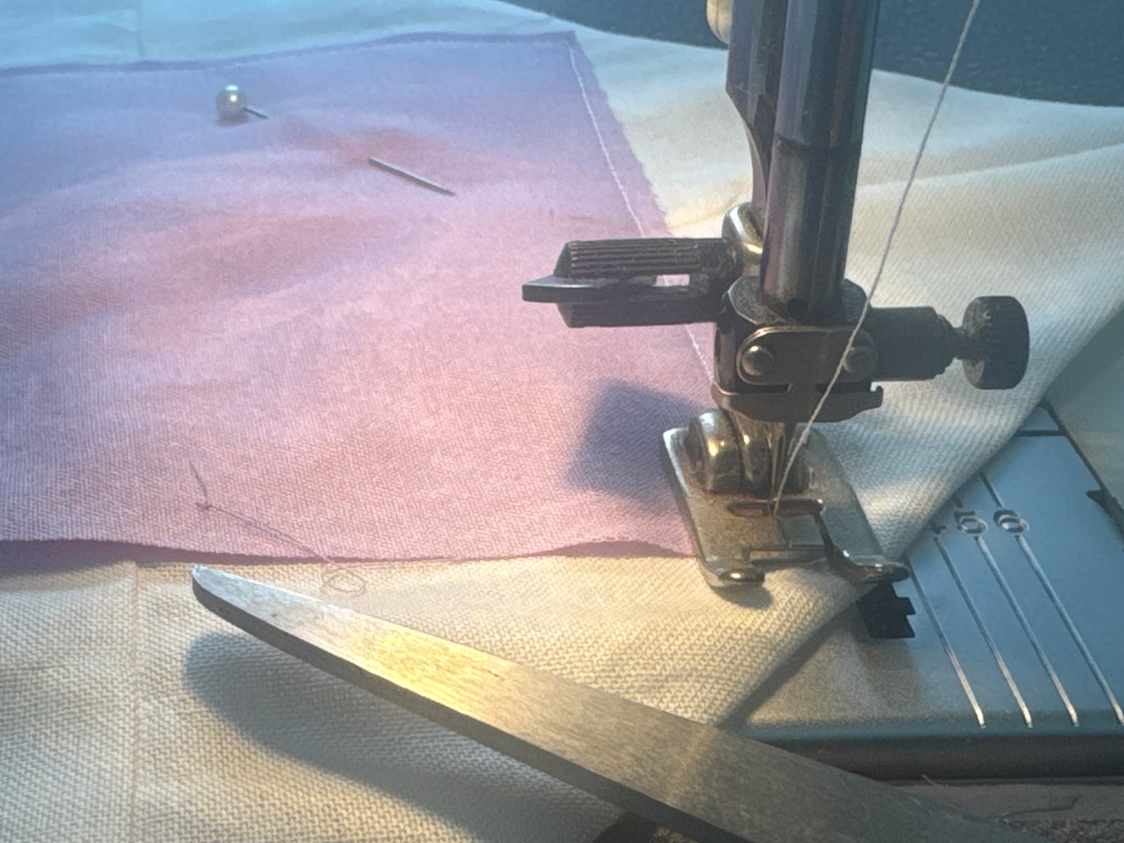 Sewing machine and fabric close-up used as a production detail image